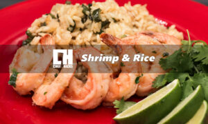 Shrimp and rice on red plate black background